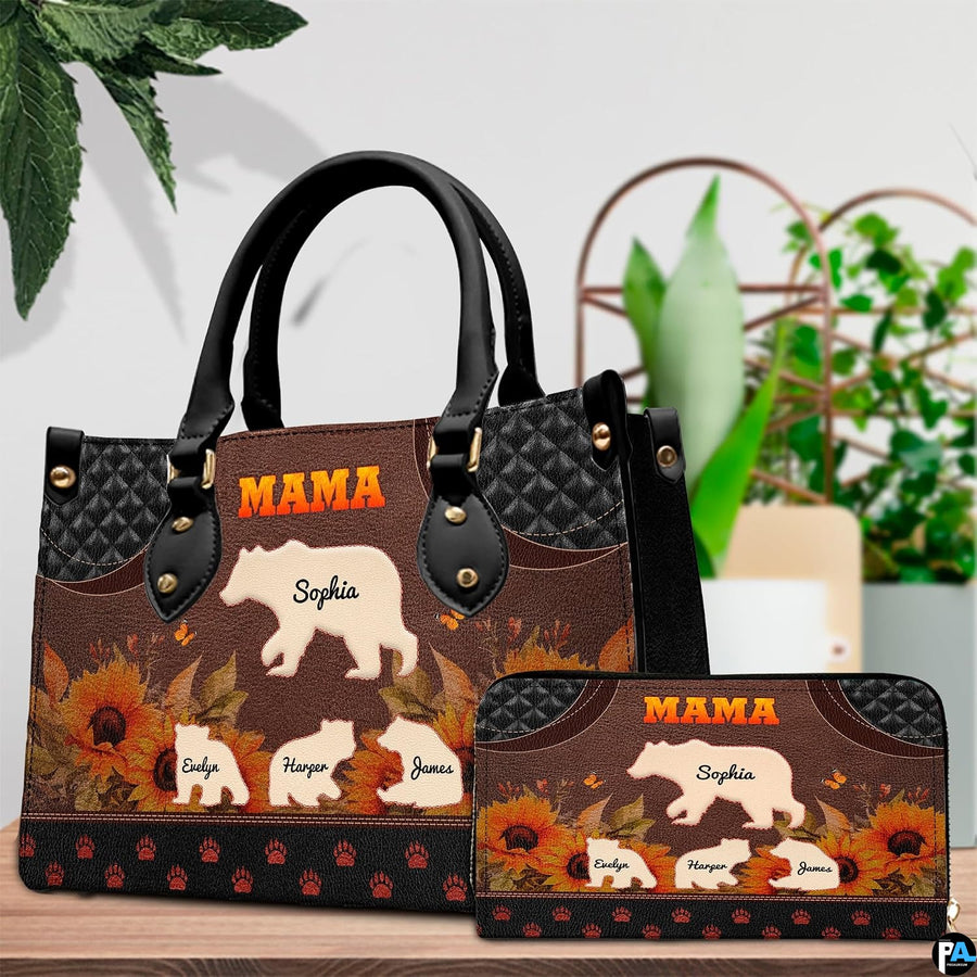 Tabletop presentation of bear family art design positioned beside lush indoor greenery.