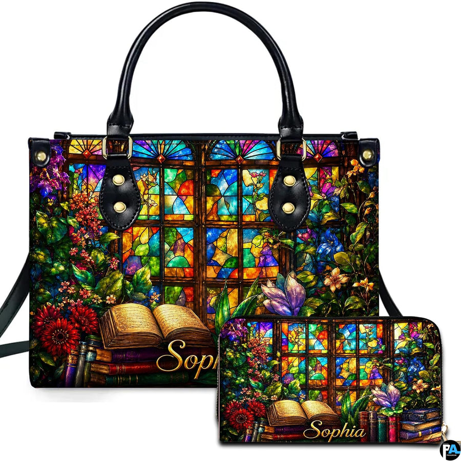 Front view of accessory set featuring stained glass window, climbing floral vines, and open book resting on book stack