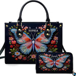 Handbag and matching wallet set featuring an embroidered butterfly and floral wreath on midnight navy.