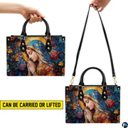 Dual carrying demonstration showing top handle and shoulder wear for the rose garden Mary handbag
