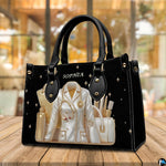 Back view of black doctor handbag showing smooth solid black exterior surface