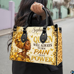 Natural daylight street presentation highlighting the gilded empress and leopard pattern illustration held on sidewalk.