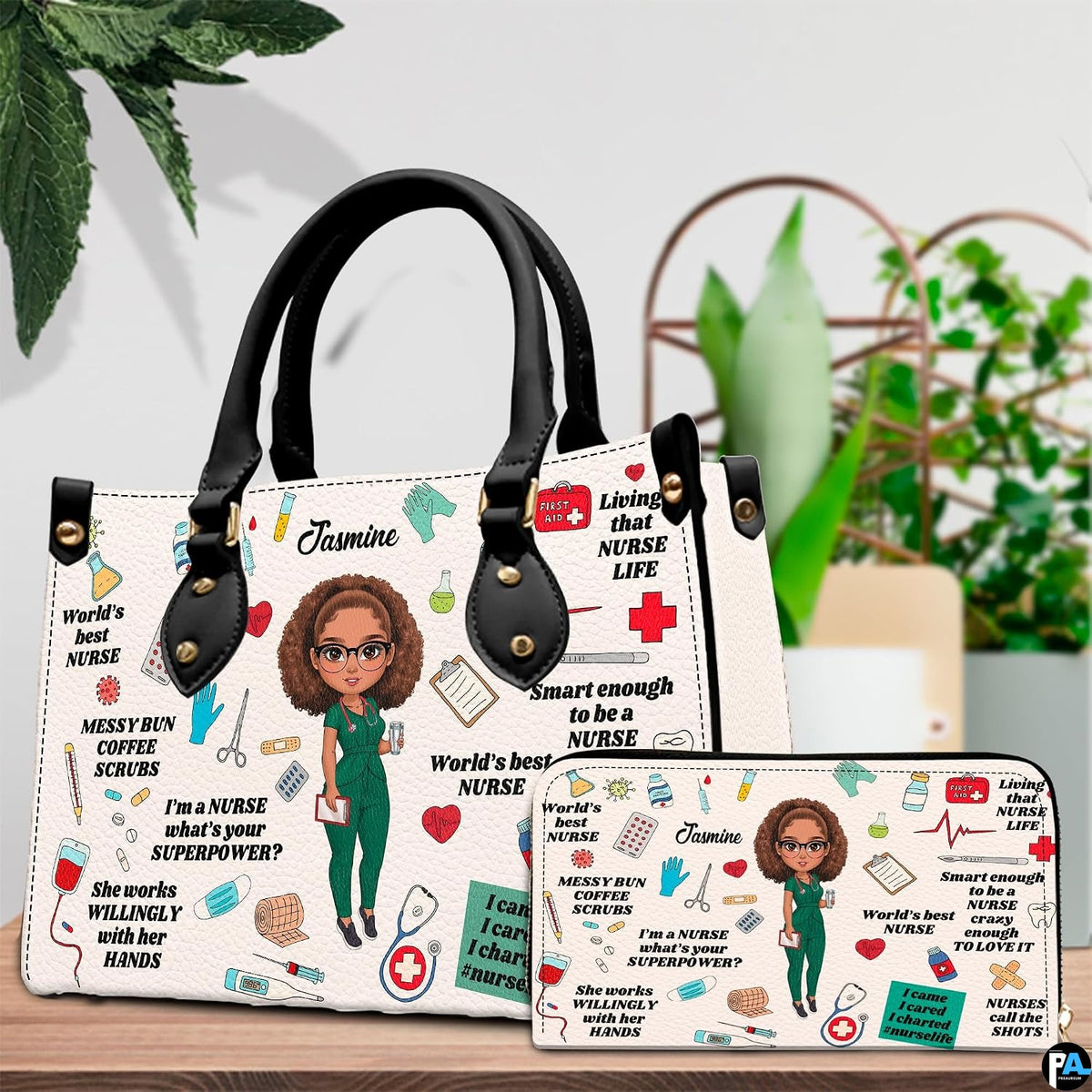 Nurse scrubs illustration handbag and matching wallet set displayed on tabletop beside greenery.