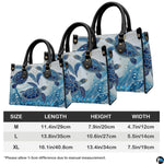 Coordinated arrangement of handbag and wallet showcasing the swimming sea turtle theme.