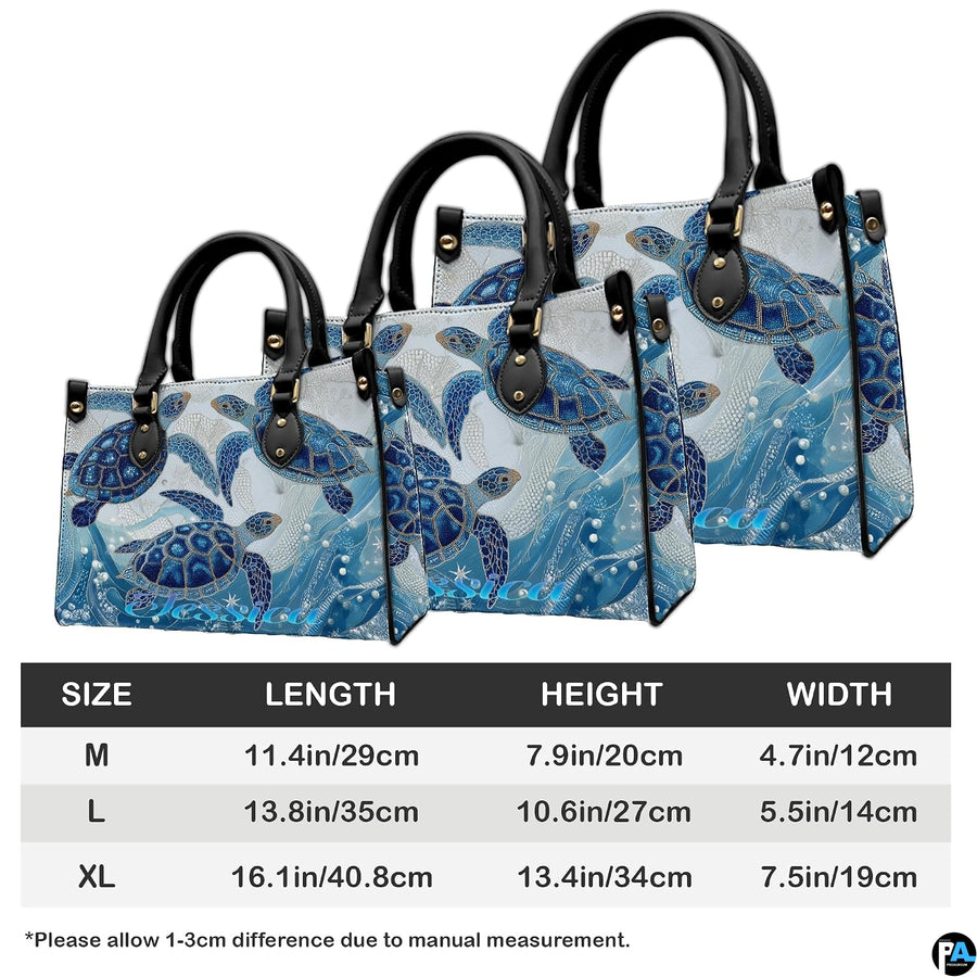 Coordinated arrangement of handbag and wallet showcasing the swimming sea turtle theme.