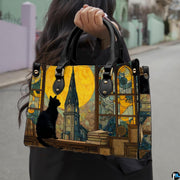 Gothic cat painting held outdoors along an urban walkway.