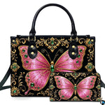 Studio presentation showing pink jeweled butterfly artwork alongside matching companion on white surface.