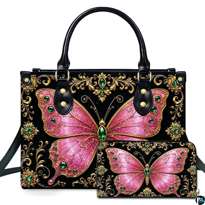 Studio presentation showing pink jeweled butterfly artwork alongside matching companion on white surface.