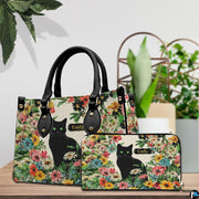 Alternative angle view showing black cat botanical handbag and wallet matching pair