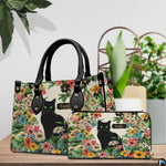 Alternative angle view showing black cat botanical handbag and wallet matching pair