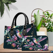 Handbag and matching wallet set displayed together on wooden table beside a green houseplant.