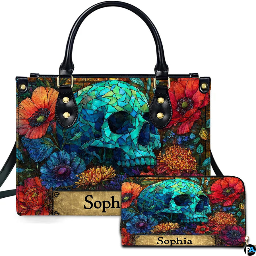 Stained glass mosaic skull floral handbag and matching wallet set on white background.
