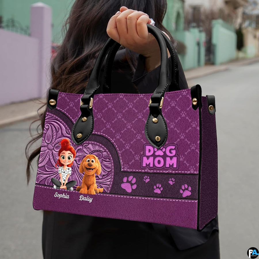 Close-up front view of cartoon girl and puppy artwork on structured tote handbag