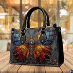 Side profile of stained glass butterfly handbag showing sleek structured silhouette