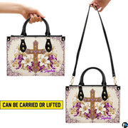 Carrying options demonstrated with the floral golden cross devotional handbag.