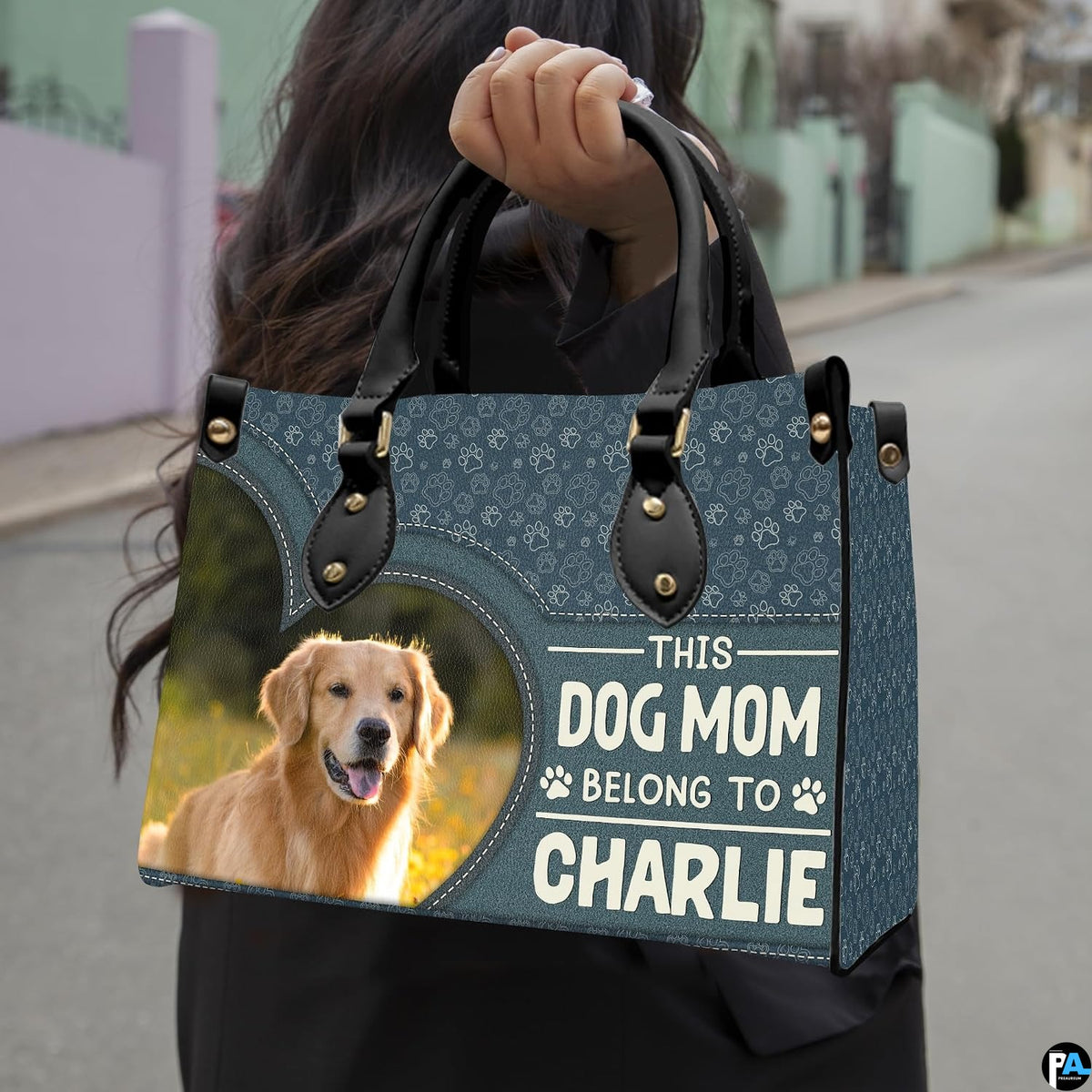 Angled display of dog lover handbag paired with coordinating zippered wallet companion.
