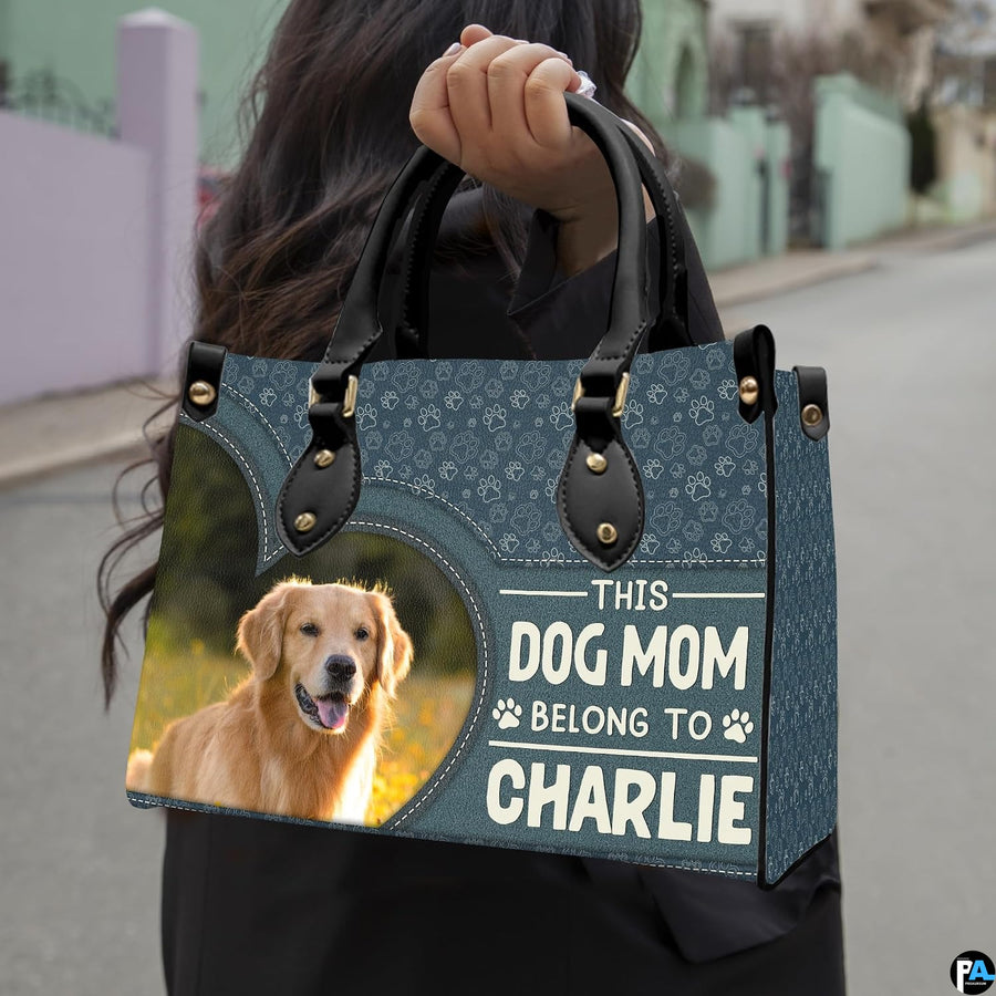 Angled display of dog lover handbag paired with coordinating zippered wallet companion.