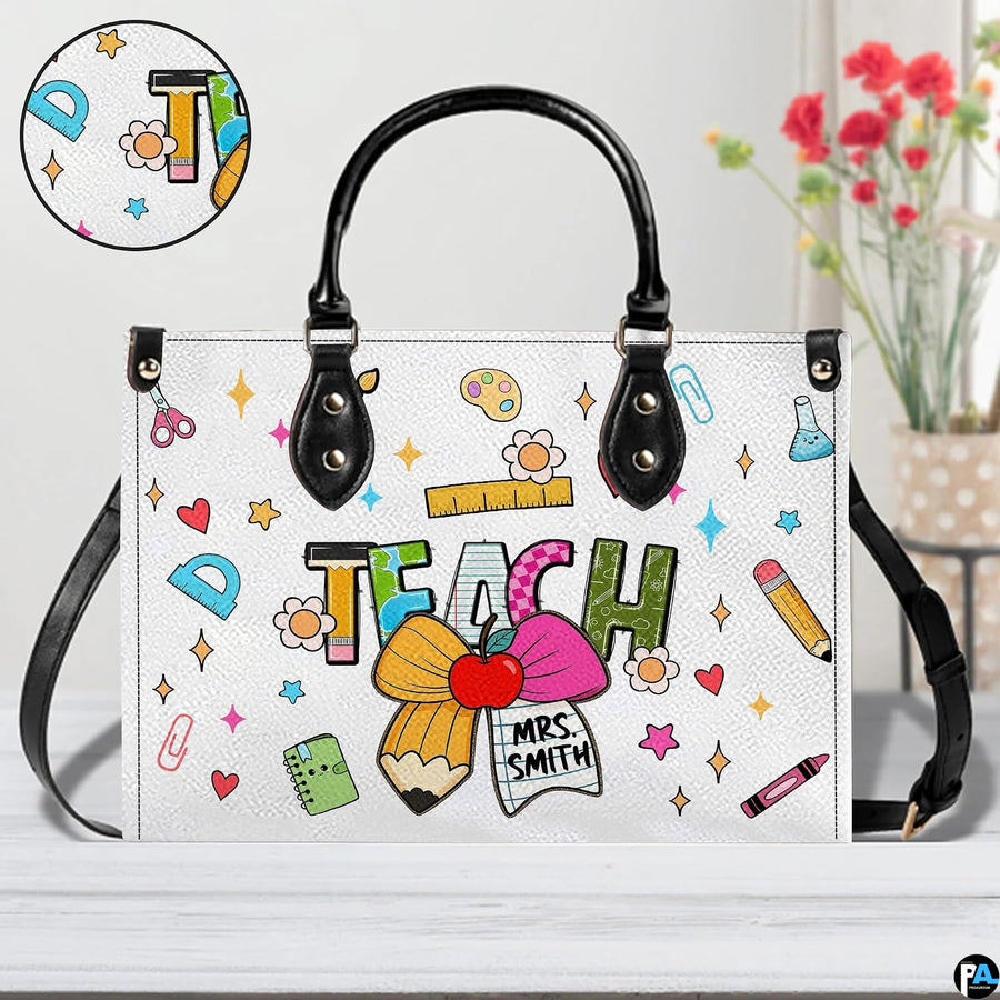 Handbag interior compartment arranged for daily personal and teaching supplies.