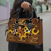 Urban outdoor photo showing the melanin queen sunflower artwork held along a city street.