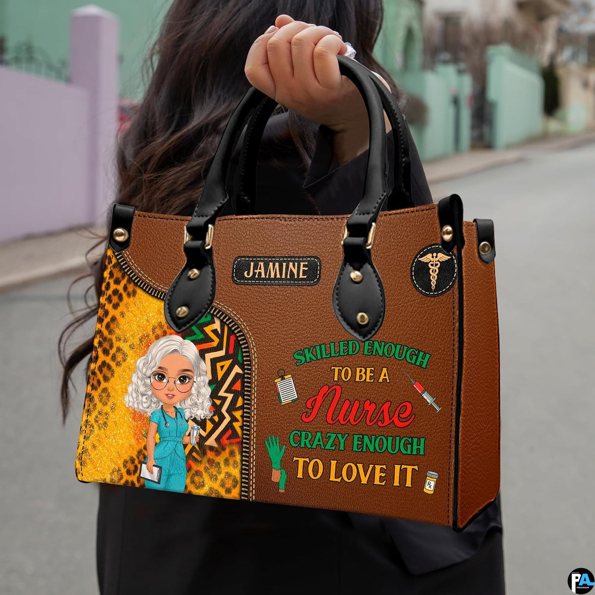 Chibi nurse cheetah print handbag held outdoors showing visual scale against street setting.