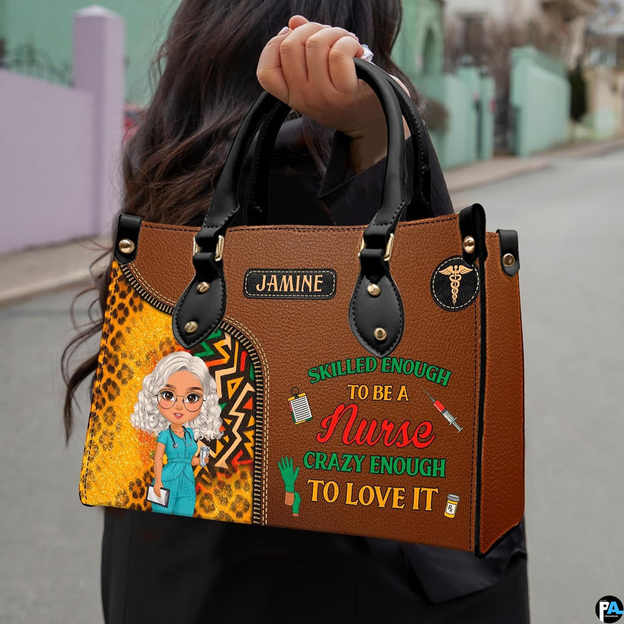 Chibi nurse cheetah print handbag held outdoors showing visual scale against street setting.