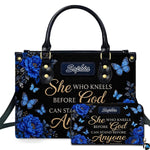 Front view of royal blue peony handbag and matching wallet with azure butterflies and golden calligraphy.