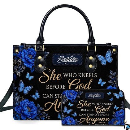 Front view of royal blue peony handbag and matching wallet with azure butterflies and golden calligraphy.