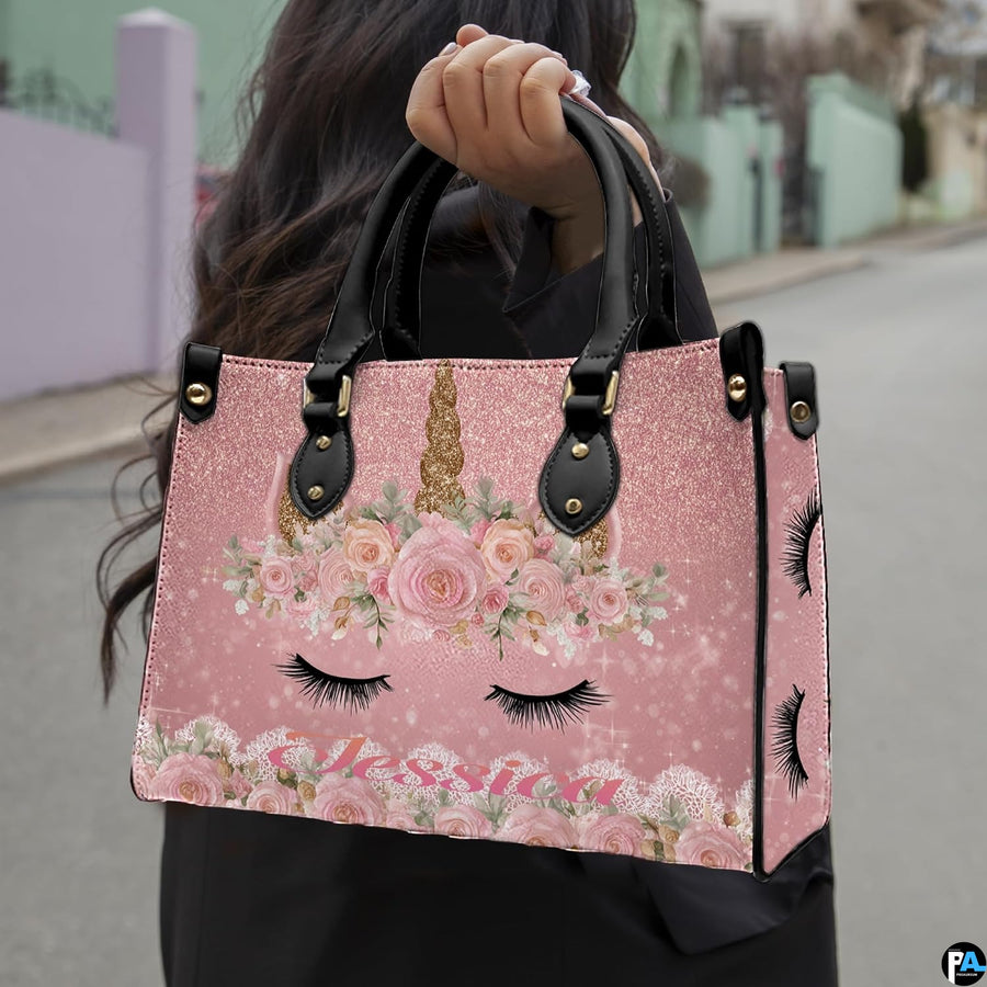 Top down view of floral unicorn handbag showing zipper closure and interior opening.