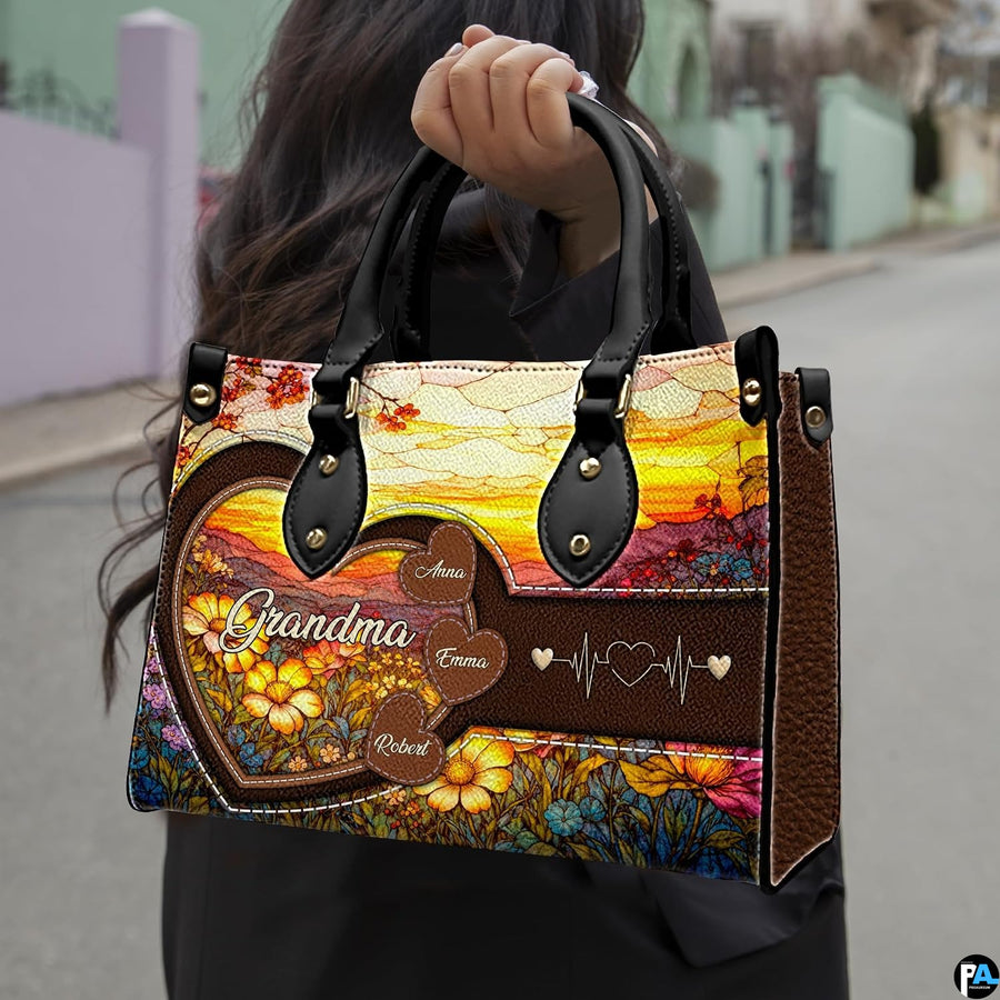 Outdoor lifestyle perspective showing stained glass wildflower sunrise artwork held by pedestrian.