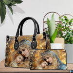 Bejeweled Mary and baby Jesus handbag and matching wallet displayed on table next to green plants
