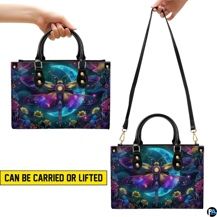 Top view of celestial moth handbag showing zippered top closure and dual structured handles