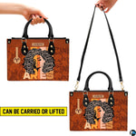 Top-down view of zodiac afro queen handbag showing dual carrying handles.