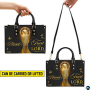Detailed view of radiant golden halo, veiled silhouette, and glittering starlight particles on handbag.
