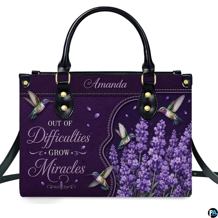 Purple hummingbird handbag displayed with matching continental wallet