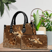 Front view of crowned giraffe handbag displaying regal gold tiara and warm earth tones.