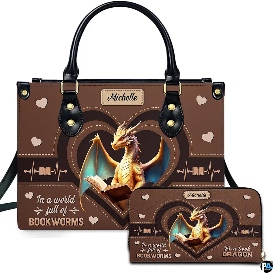 Front view of structured handbag featuring golden dragon reading inside heart frames, displayed with matching wallet