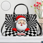 Optical illusion Santa handbag displayed in studio setting with circular texture swatch inset.