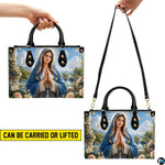 Angled view showing structured Virgin Mary scenic river valley handbag
