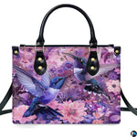 Front view of matching wallet carrying coordinating dual hummingbird and purple floral artwork.