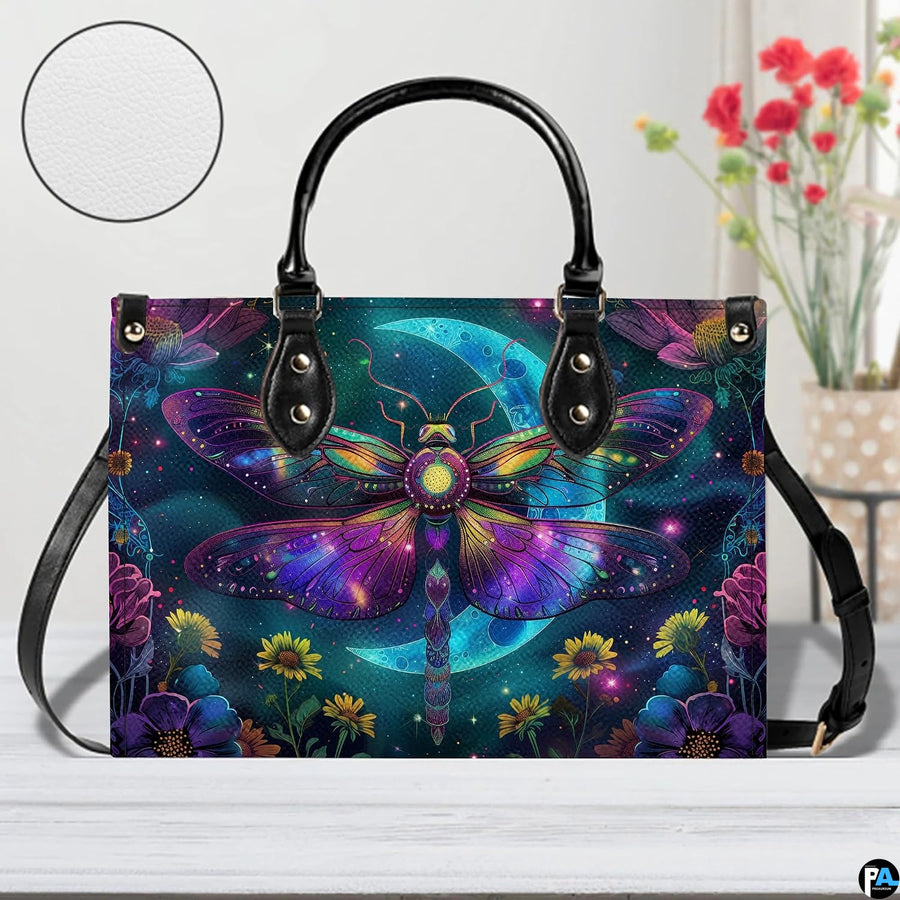 Bottom view of celestial moth handbag showing protective metal feet studs and smooth base wrap