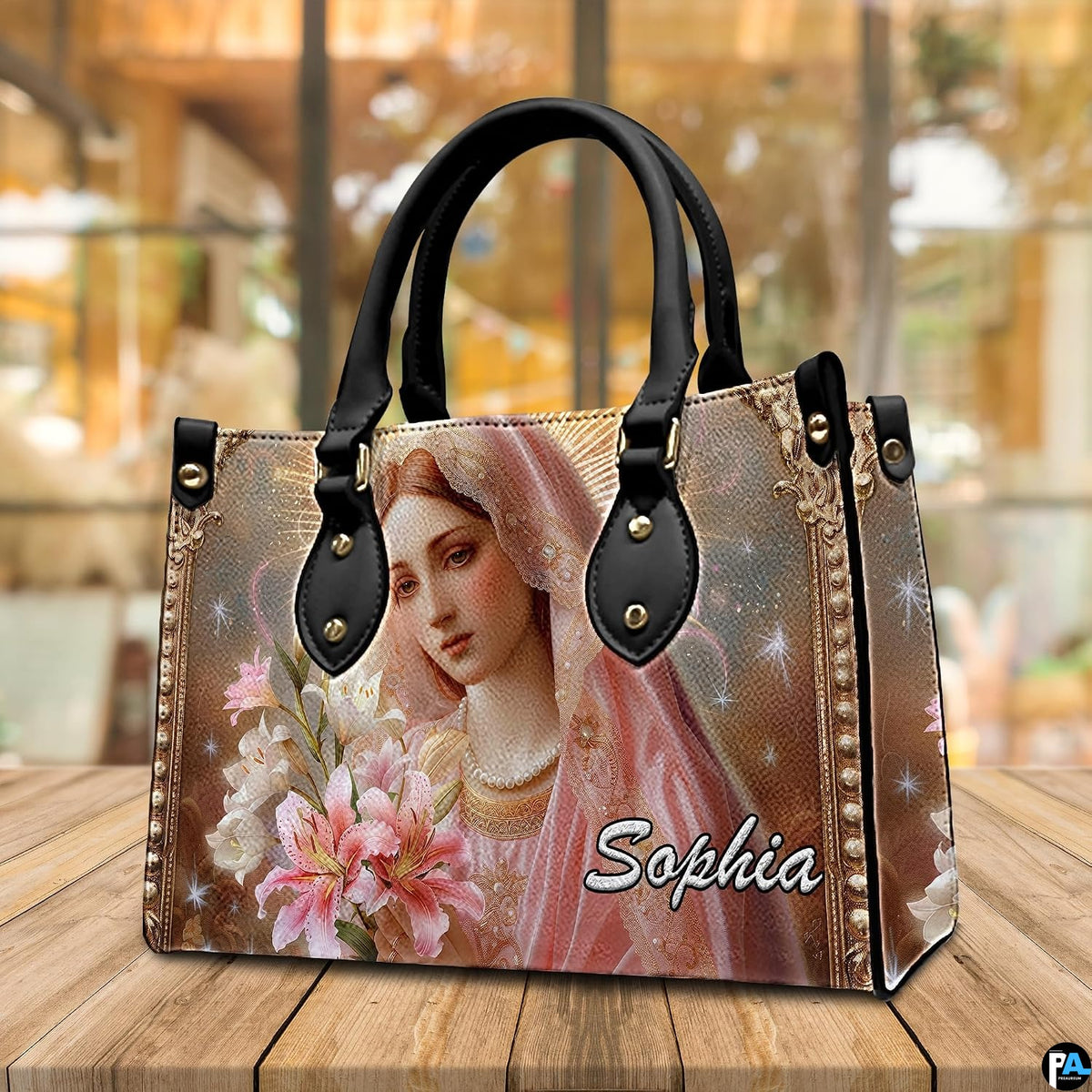 Virgin Mary botanical floral handbag presented on warm natural wooden table