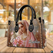 Virgin Mary botanical floral handbag presented on warm natural wooden table