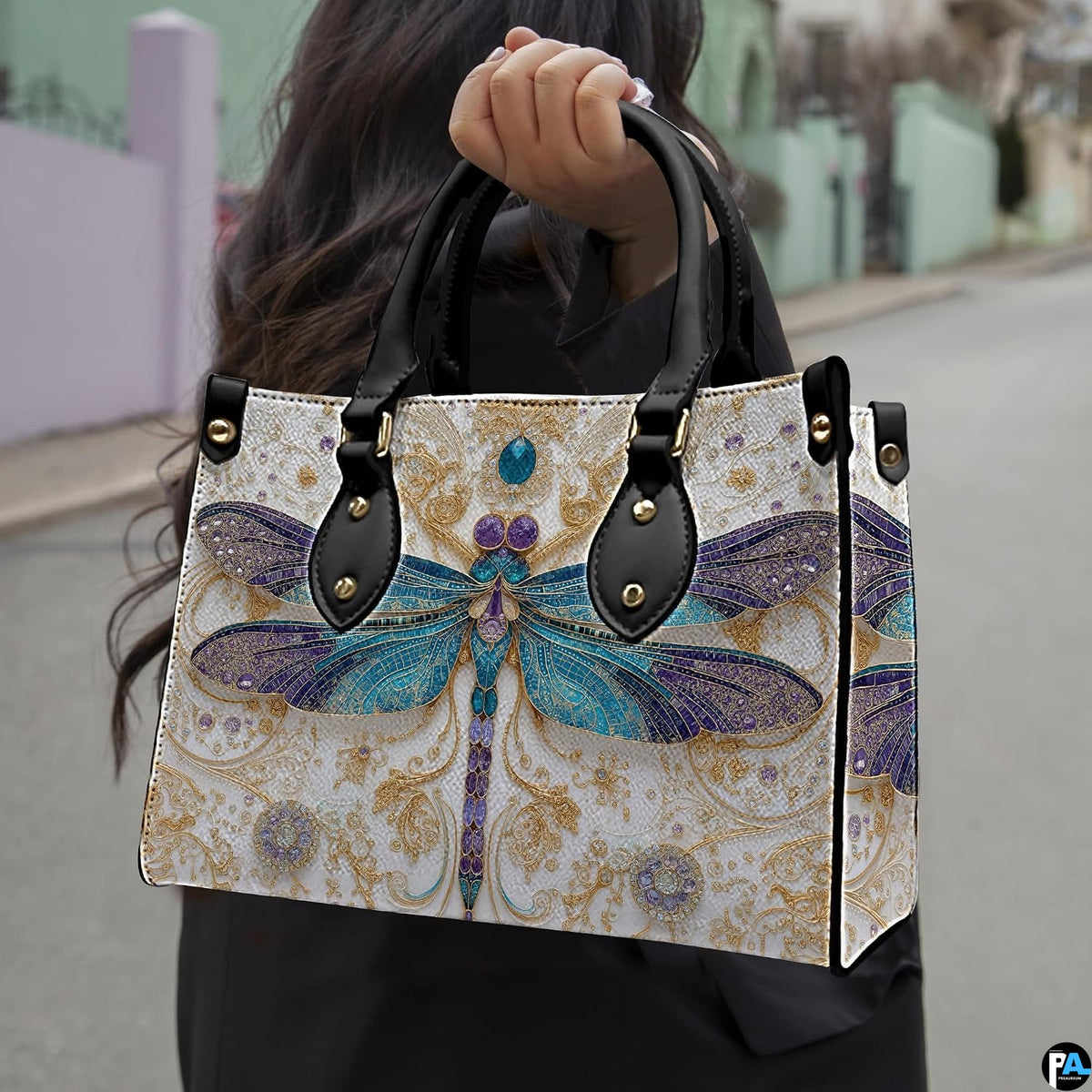 Front view of dragonfly handbag showing stained-glass wings and golden arabesque scrollwork.