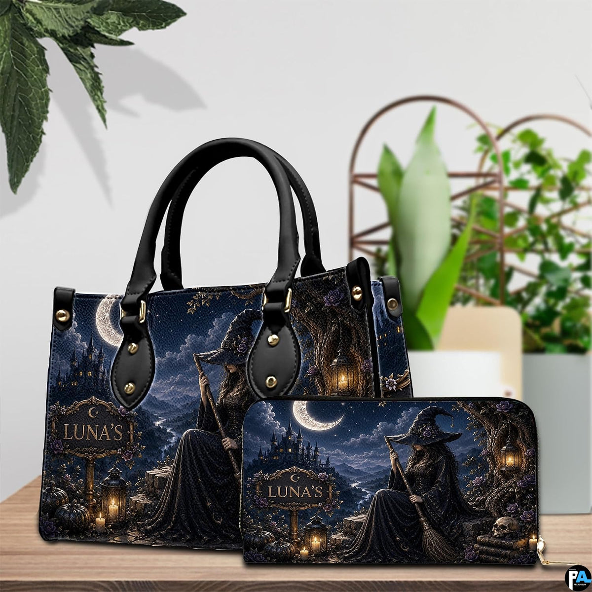 Still life tabletop arrangement showcasing the dark witch art accessory alongside decorative foliage.