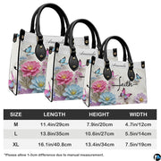 Detailed view of matching floral butterfly cross zippered wallet