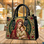 Tabletop display of Byzantine Madonna handbag highlighting ruby, emerald, and gold mosaic tones