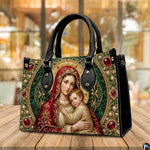 Tabletop display of Byzantine Madonna handbag highlighting ruby, emerald, and gold mosaic tones