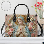 Tabletop display of porcelain Madonna handbag highlighting sculpted roses and golden halo