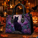 Perspective angle of gothic cat artwork on wooden tabletop with carved pumpkin and warm candlelight.