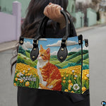 Outdoor model showcasing pastoral ginger cat and meadow landscape artwork.